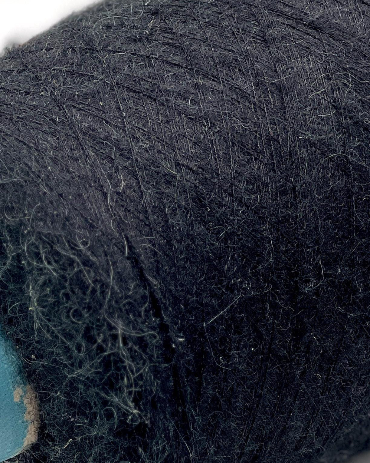 Close-up of dark blue yarn with visible texture