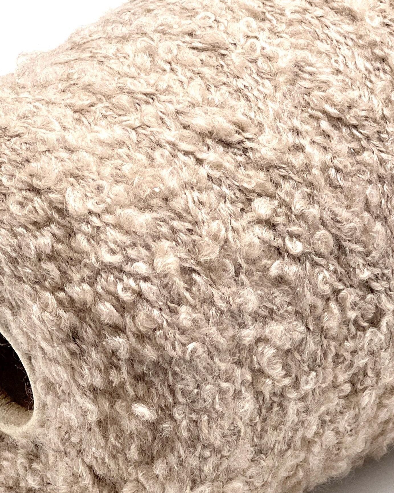 Close-up of a textured beige roll of paper towel