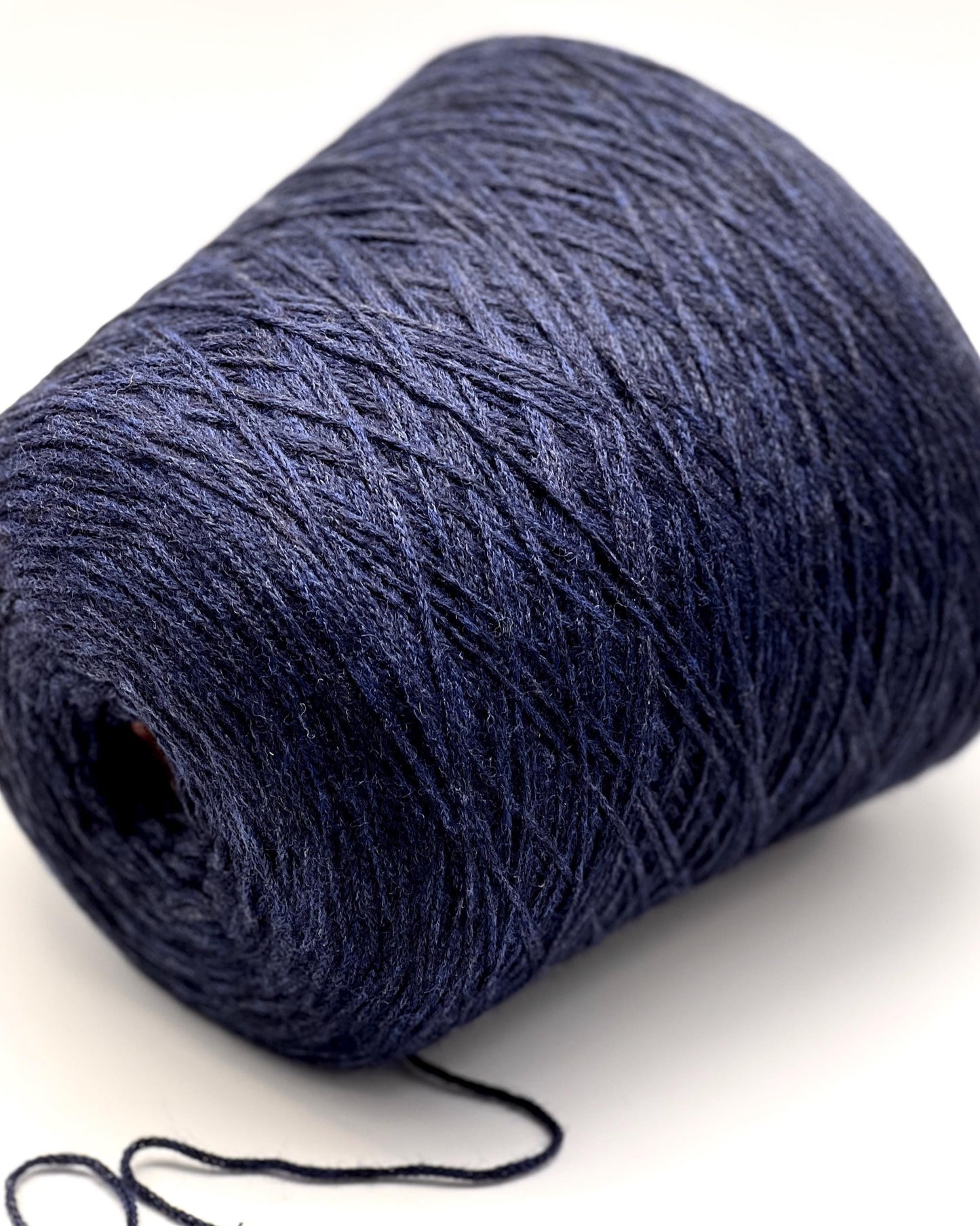 Blue skein of yarn on a white background