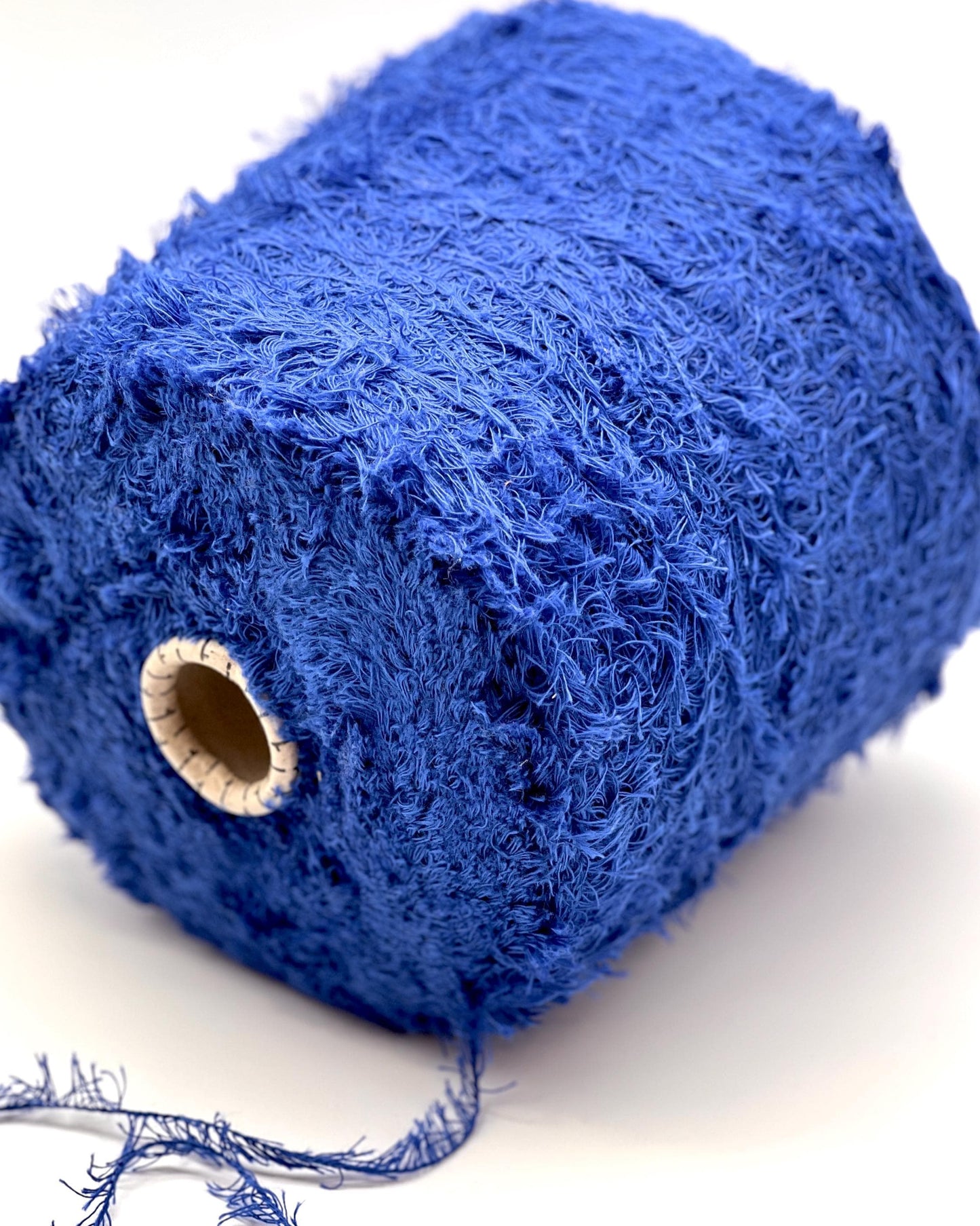 Blue skein of yarn on a white background