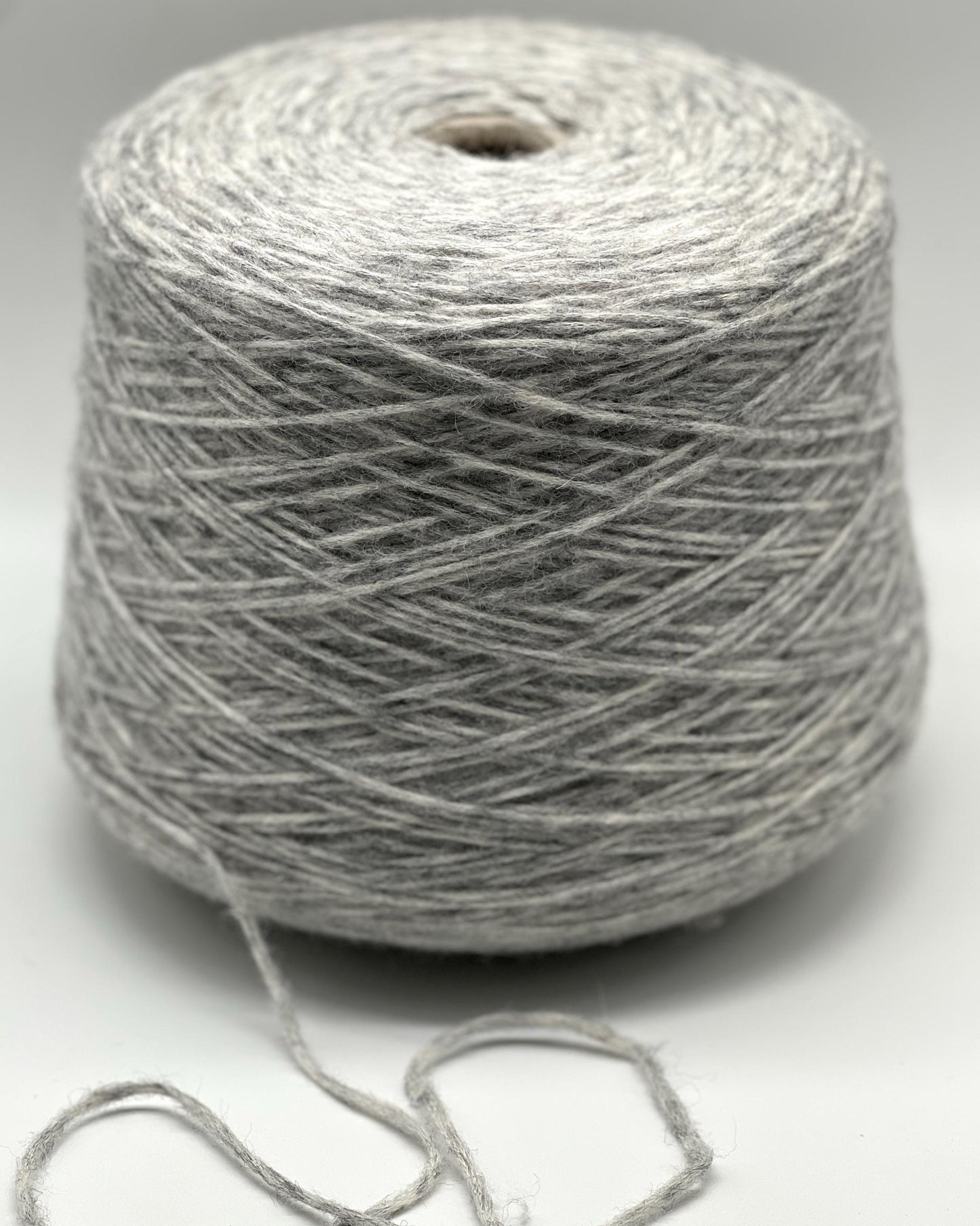 Gray skein of yarn on a white background