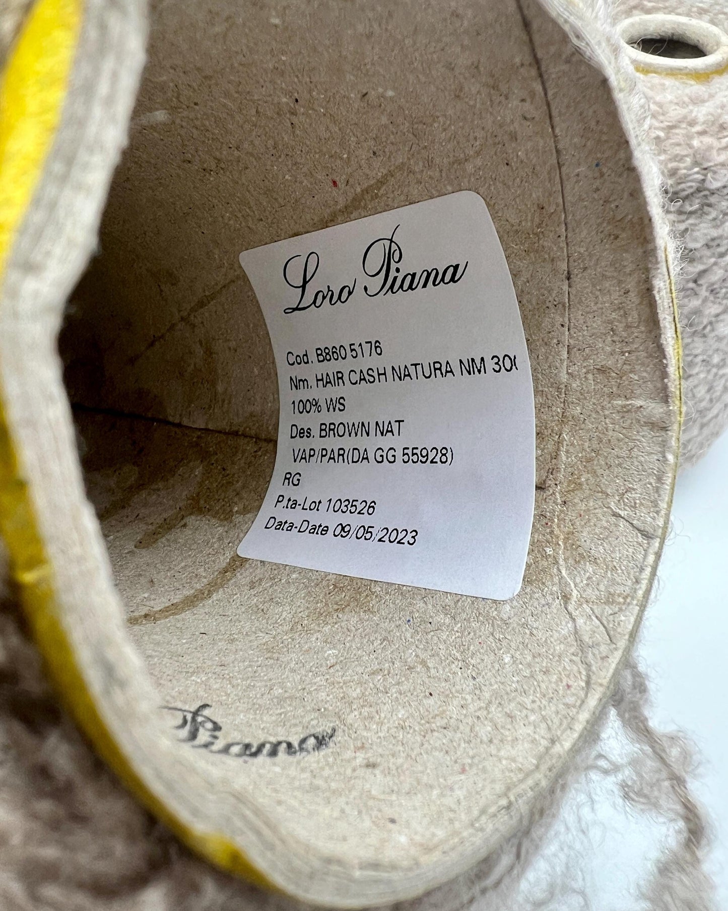Loro Piana label inside a shoe on a marble surface