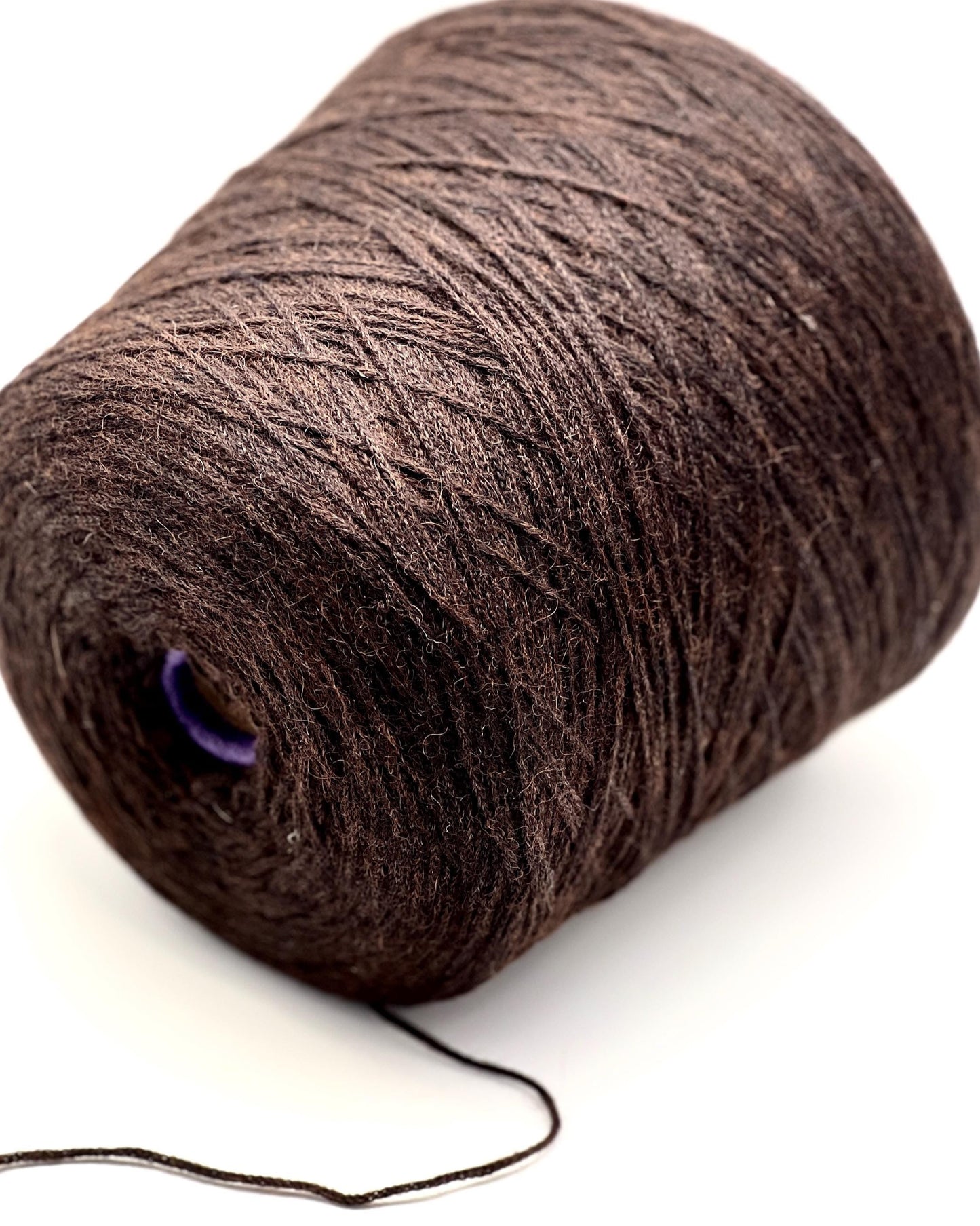 Brown skein of yarn on a white background
