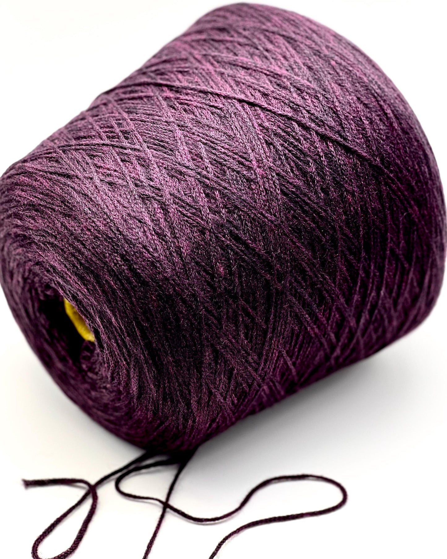 Purple yarn ball on a white background