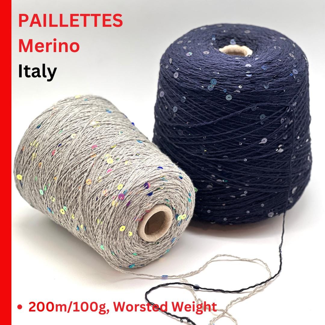 Two spools of yarn, one gray and one blue with sequins, on a white background with text indicating 'Paillettes Merino Italy' and product details.