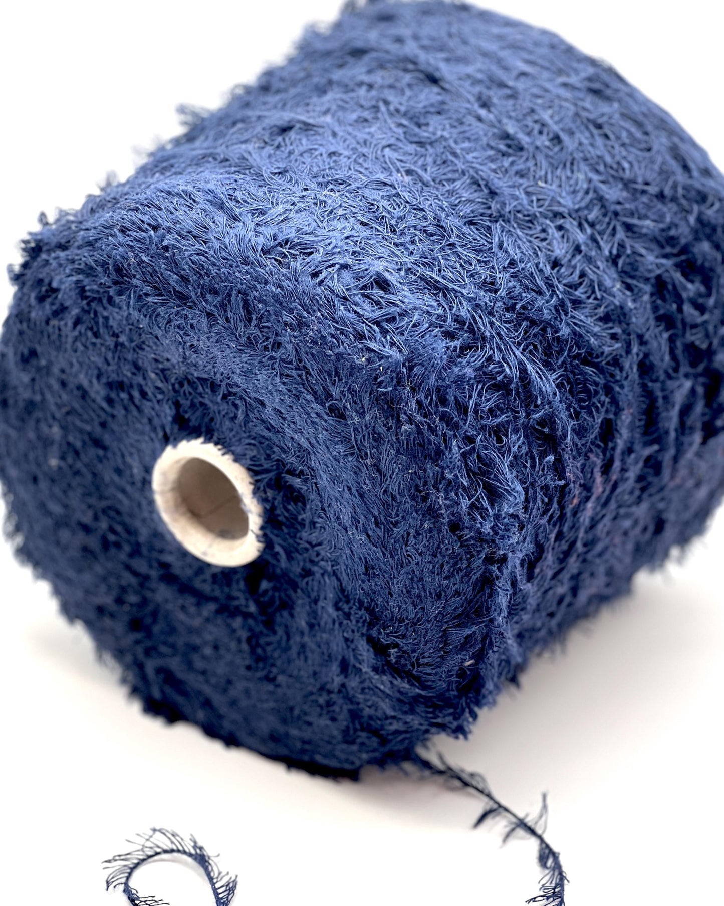 Blue textured sponge on a white background