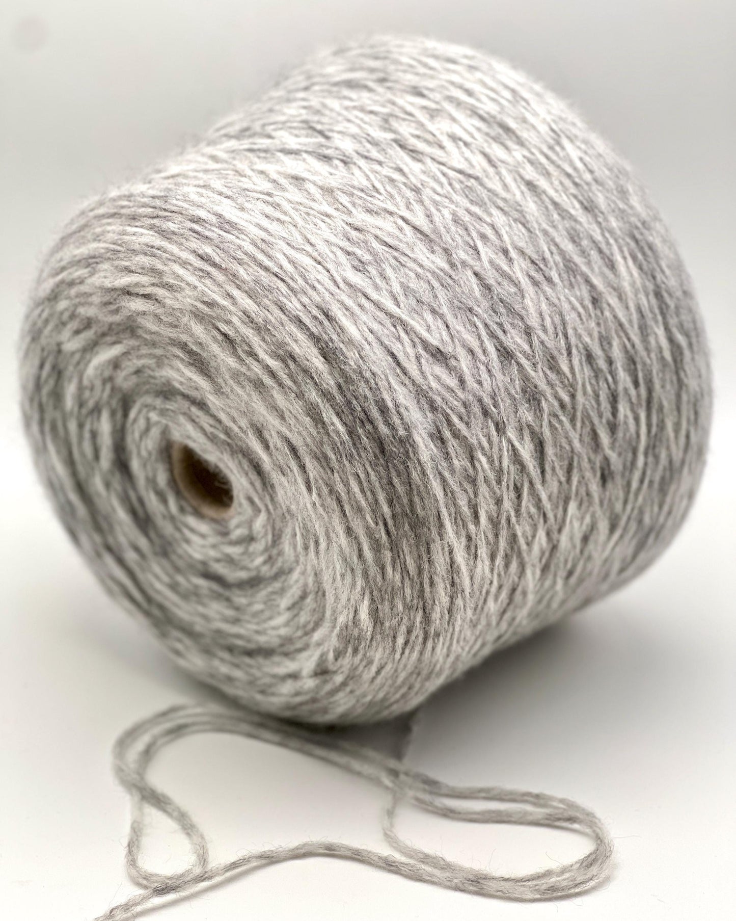 Ball of gray yarn on a white background