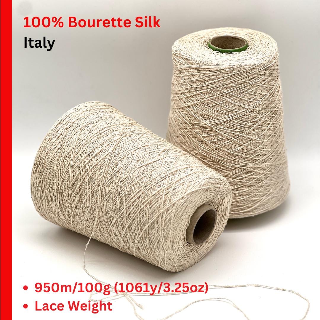 Two skeins of beige silk yarn with text indicating '100% Bourette Silk Italy' on a white background.