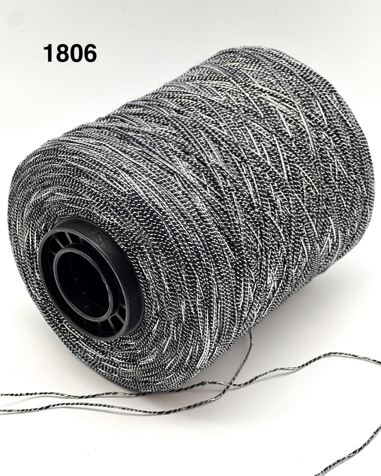 Spool of gray thread on a white background with '1806' text.