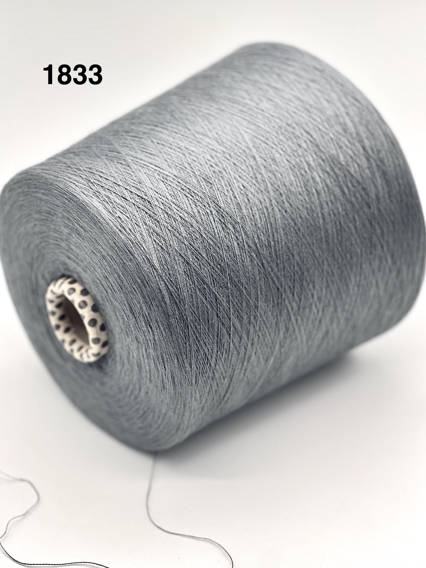 Gray spool of yarn on a white background with number 1833.