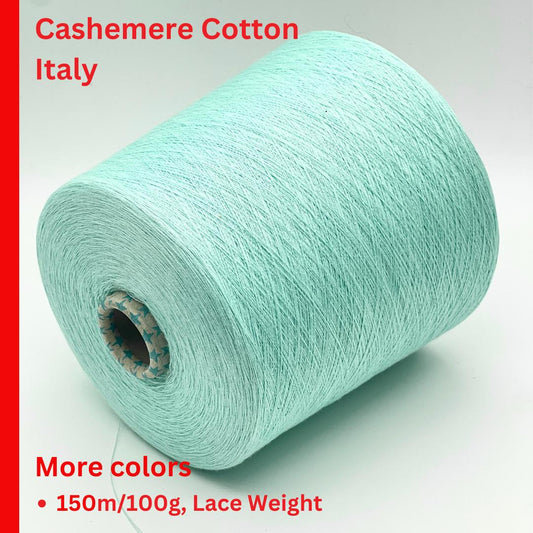 Roll of light blue yarn with text about cashmere cotton from Italy on a white background.