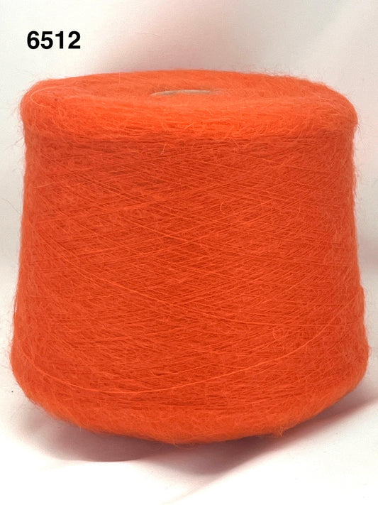 Orange spool of yarn on a white background