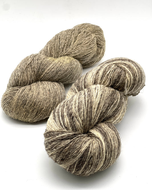 Exclusive iDOKNiT rustic fingering weight yarn, Romanov Sheep Wool from Paces Vilnas Fabrika, Latvia. 100% pure Romanov wool traditionally processed to retain 70% natural lanolin for extreme durability and weather resistance. Single-ply construction providing 420m per 100g. Curated by iDOKNiT in natural and tweed-effect dyed shades for heritage-style, hearty knitwear.