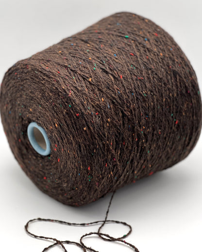 Gruppo Tessile Industriale WEB TWEED Italian cashmere yarn shown on professional cones. This 100% carded cashmere sport weight yarn features a subtle, modern tweed texture and soft loft. Premium luxury designer yarn available at iDOKNiT.com.