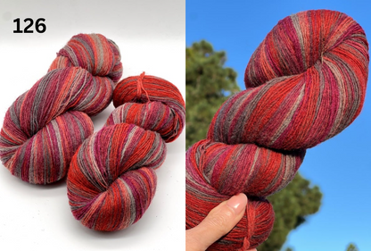 Small-batch dyed skeins of 100% Latvian Dark-Headed Sheep Wool in varied earth tones and vibrant multi-colors like Green-Brown striped 052. The rustic single-ply texture is shown in detail, including images of the sheep and the historic Paces Vilnas Fabrika origin. Available at iDOKNiT.com.