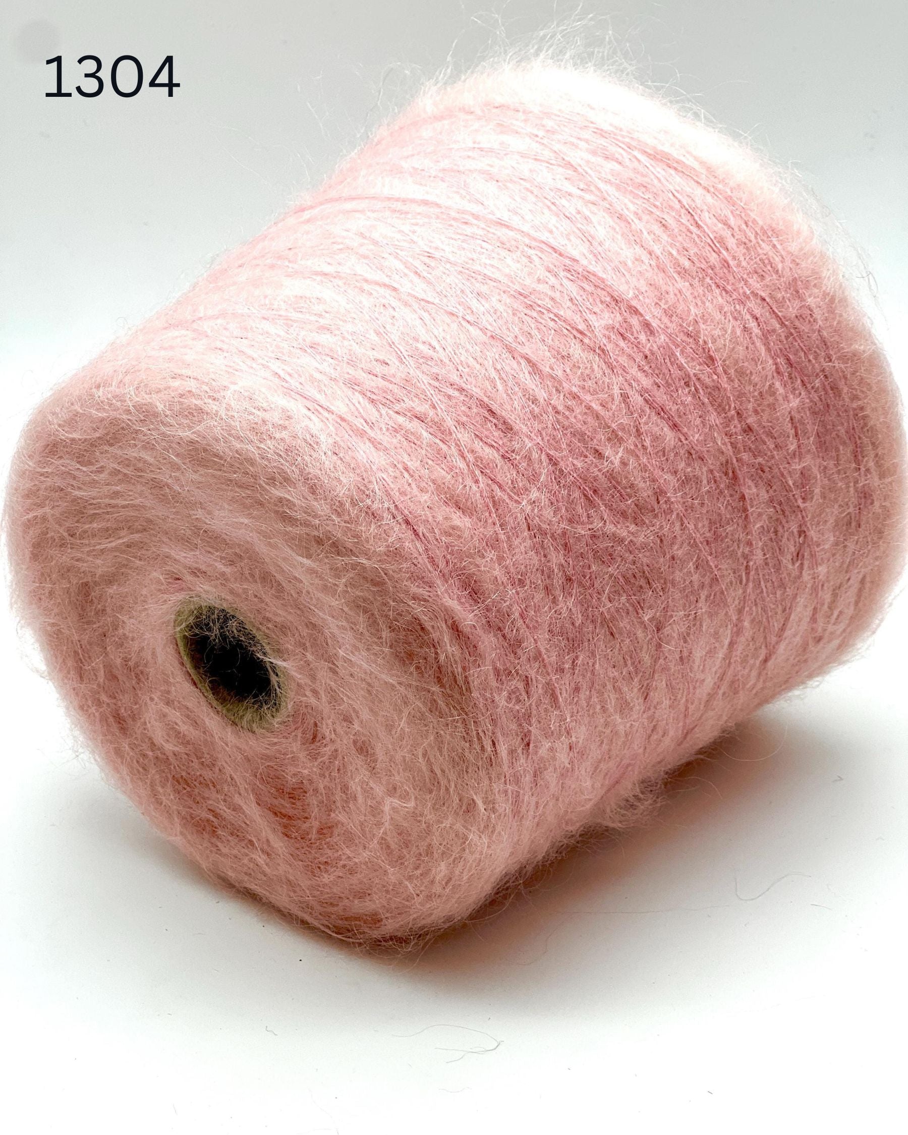 Exclusive iDOKNiT extra fine lace weight yarn, AURORA 100 by Ilaria Italy. A luxury cloud-like brushed mohair blend of 67% superkid mohair, 30% polyamide, and 3% extra fine merino wool providing 1000m per 100g. Authentic Italian-made premium fiber curated by iDOKNiT for airy standalone knitting, delicate lace shawls, and rich multi-strand garment blending.