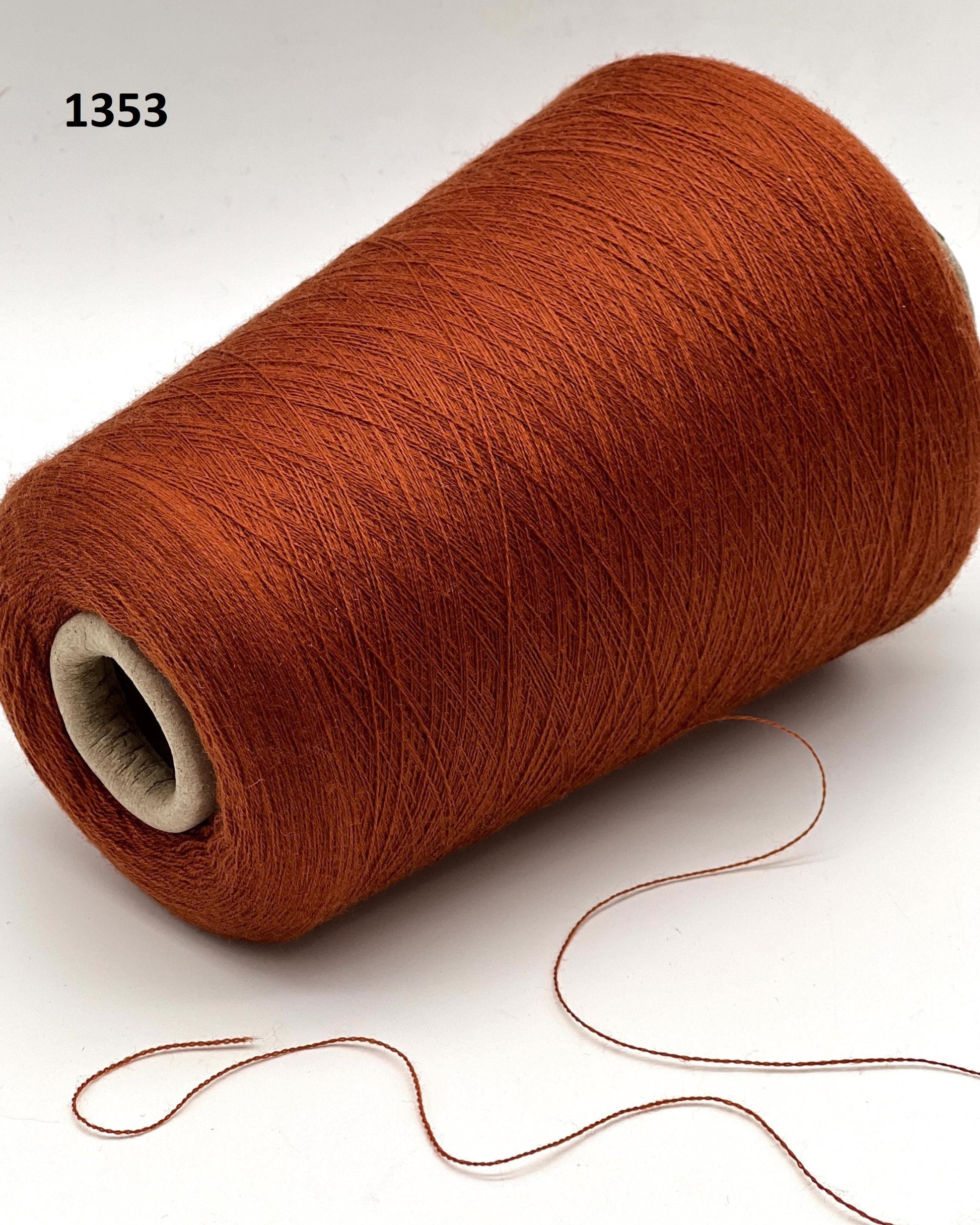 Brown spool of yarn on a white background