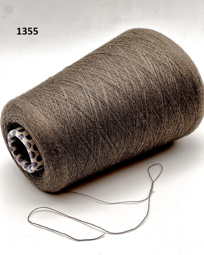 Spool of brown thread on a white background
