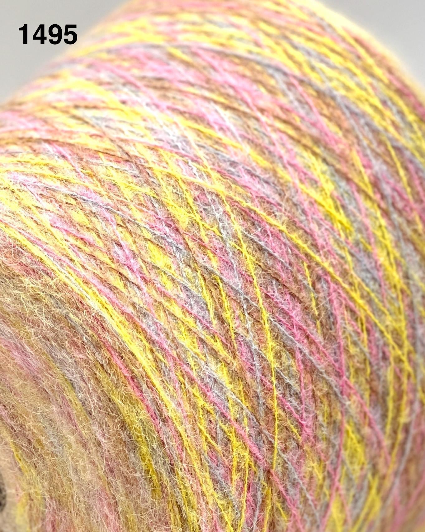 Close-up of a skein of multicolored yarn with a focus on yellow and pink shades.