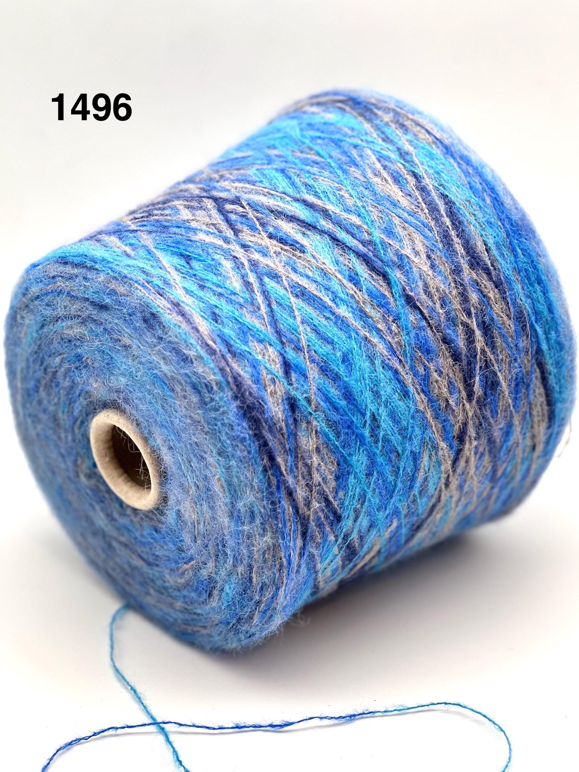 Spool of blue yarn on a white background