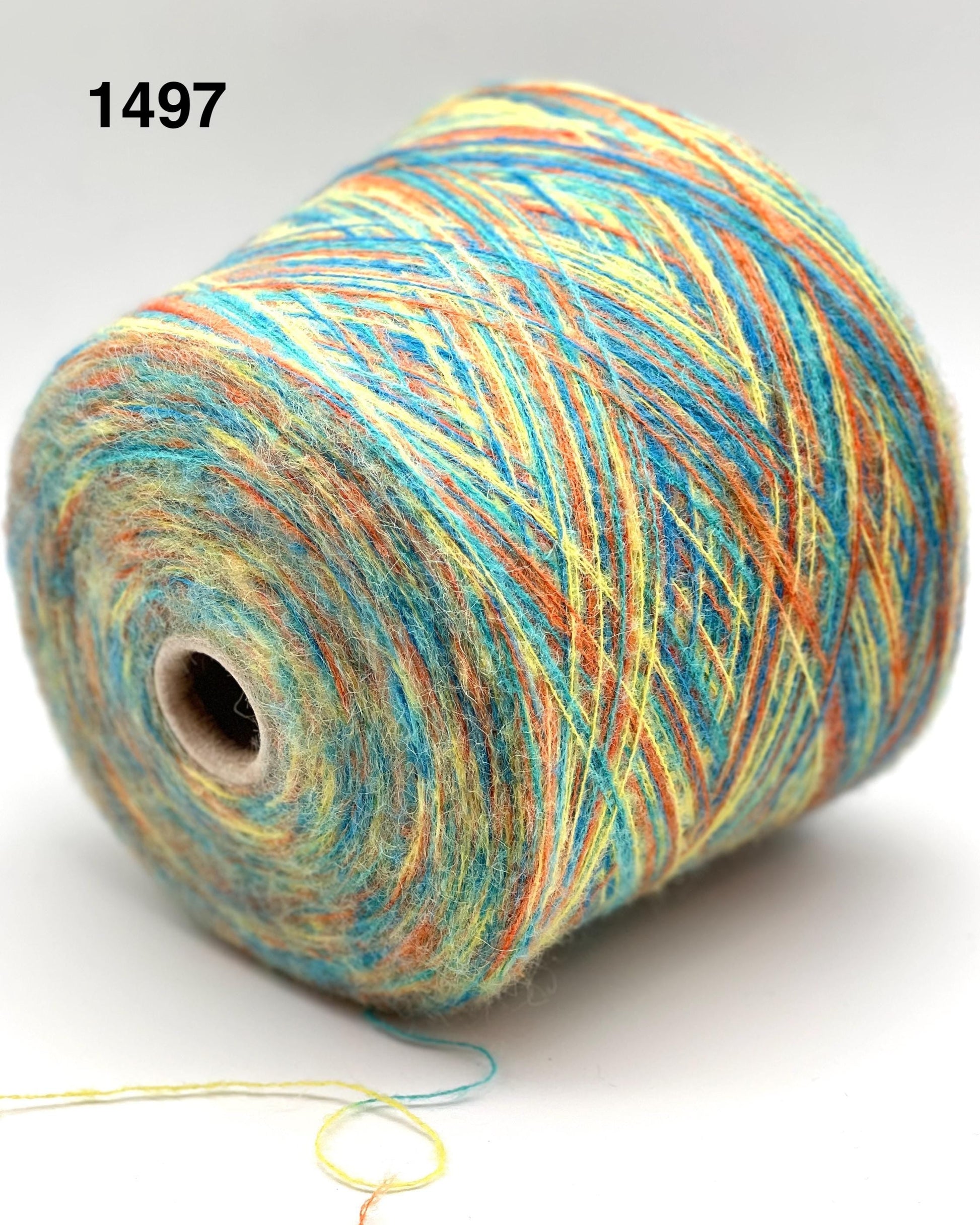Spool of multicolored yarn on a white background