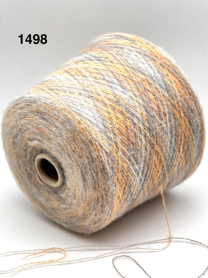 Spool of multicolored yarn on a white background