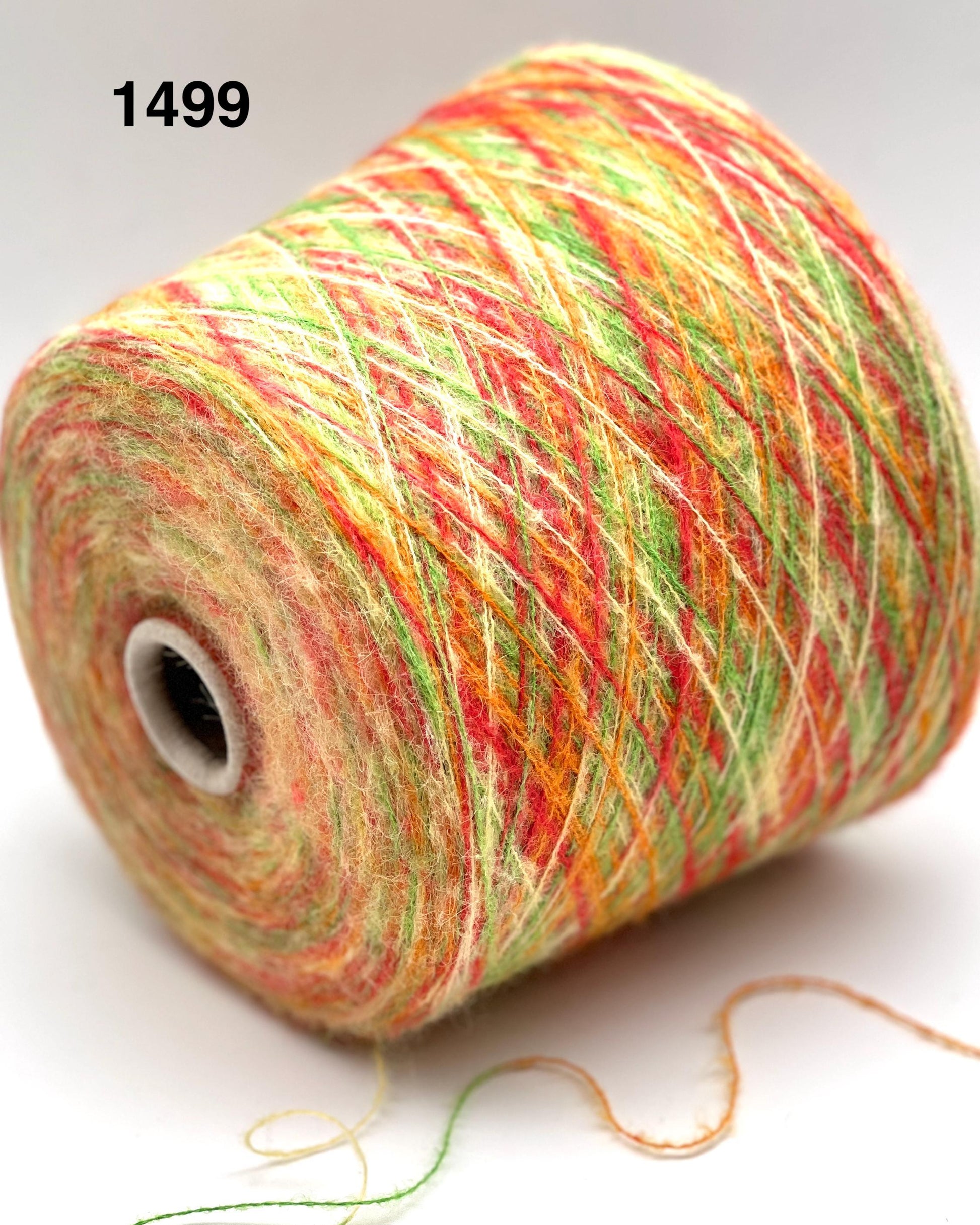 Spool of multicolored yarn on a white background