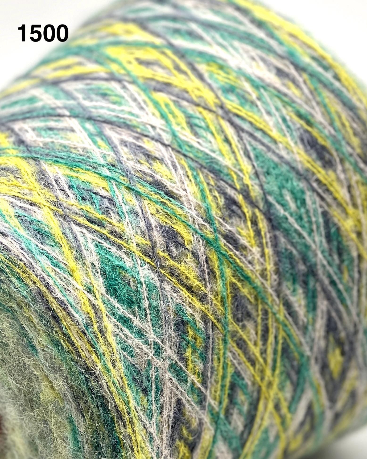 Close-up of a ball of multicolored yarn with green, yellow, and gray hues.