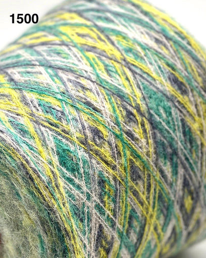 Close-up of a ball of multicolored yarn with green, yellow, and gray hues.