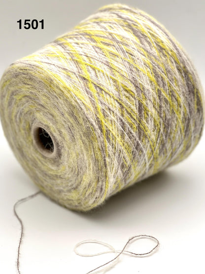 Spool of multicolored yarn on a white background