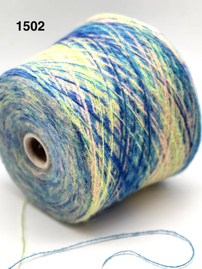 Spool of multicolored yarn on a white background