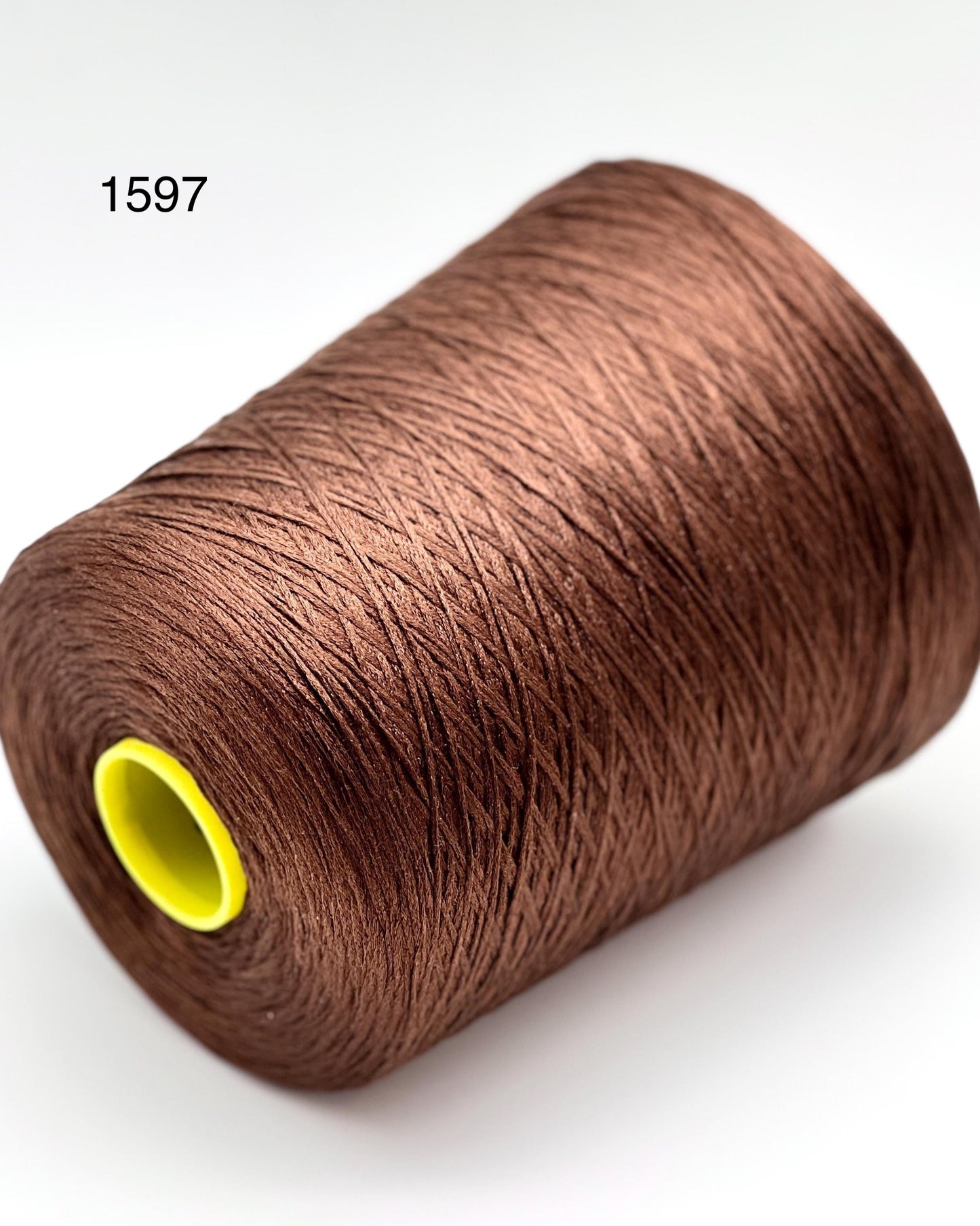 Luxury iDOKNiT fine weight yarn, SETA SHAPPE by Filati Buratti Italy. 100% Seta Shappe Silk with a unique chainette construction for superior elasticity and drape, 600m/100g. Authentic Italian-made silk on cones, color 2153 White, curated by iDOKNiT for high-end hand and machine knitting projects.