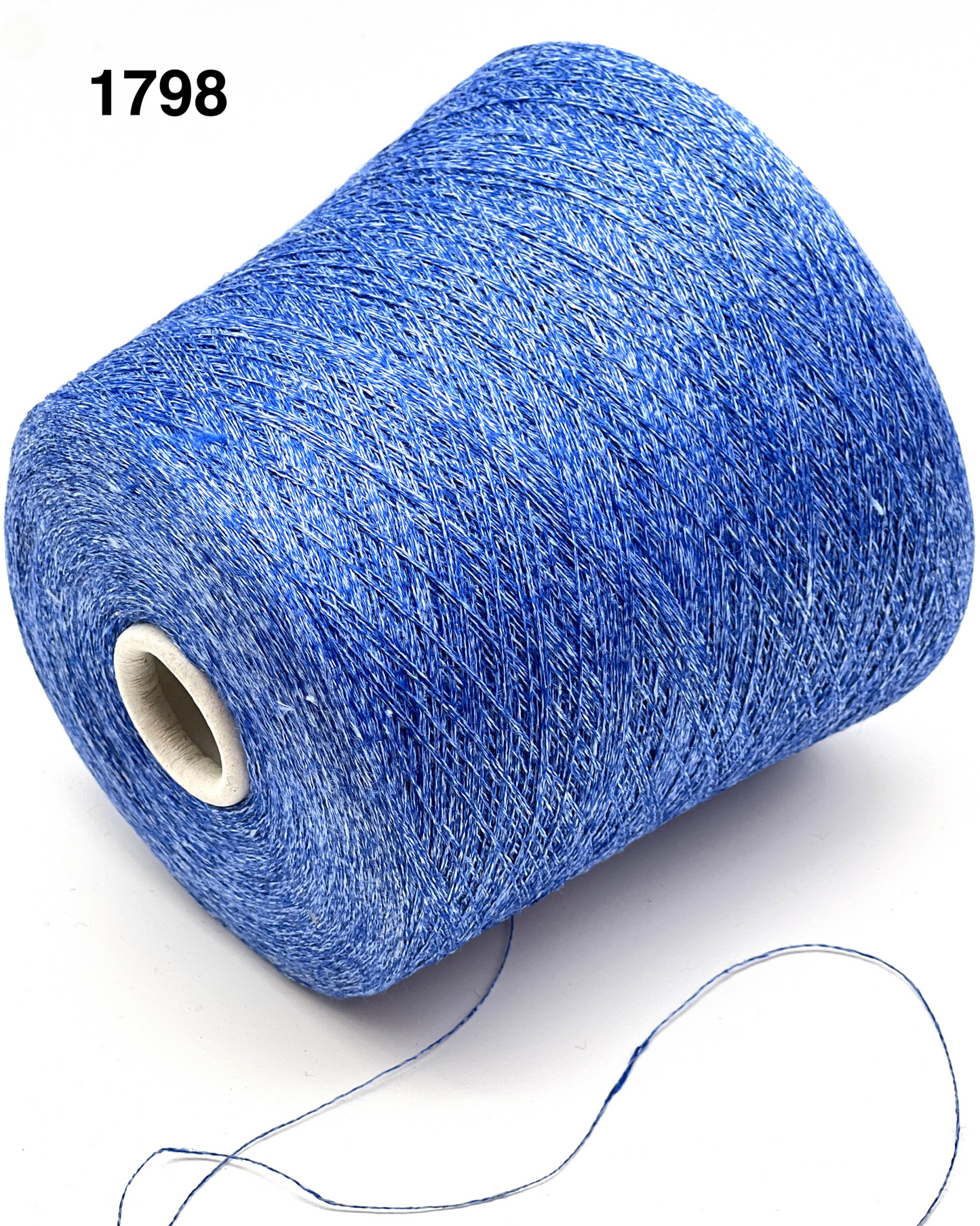 Blue spool of thread with a white background