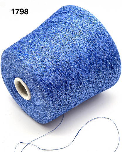 Blue spool of thread with a white background