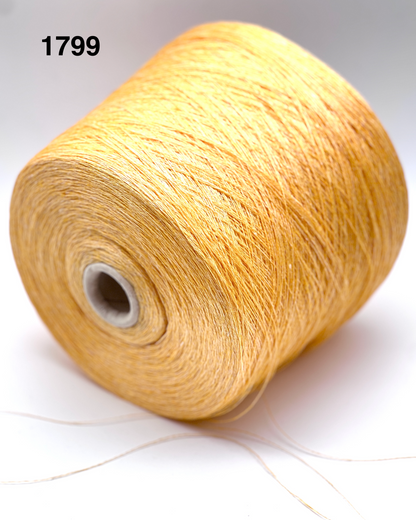Spool of beige yarn on a white background