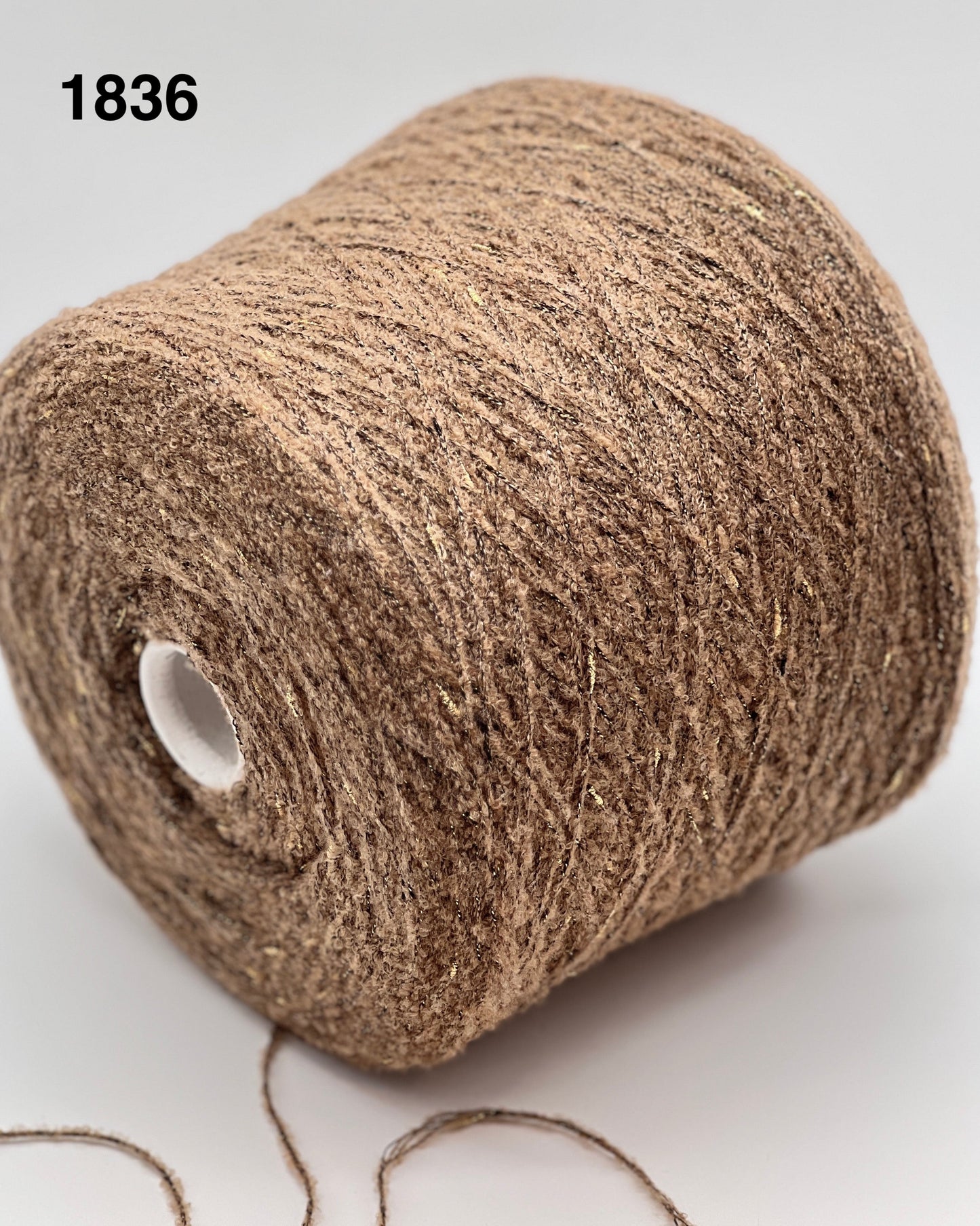 Brown yarn roll on a white background, color 1836