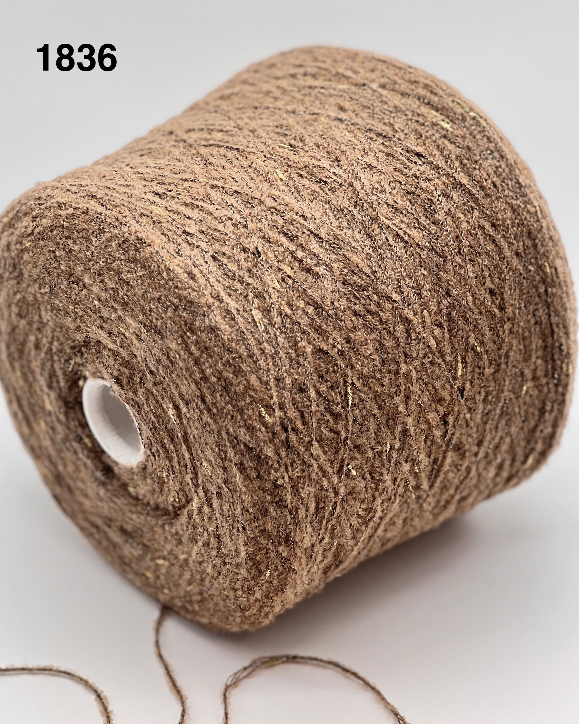 Brown yarn roll on a white background, color 1836