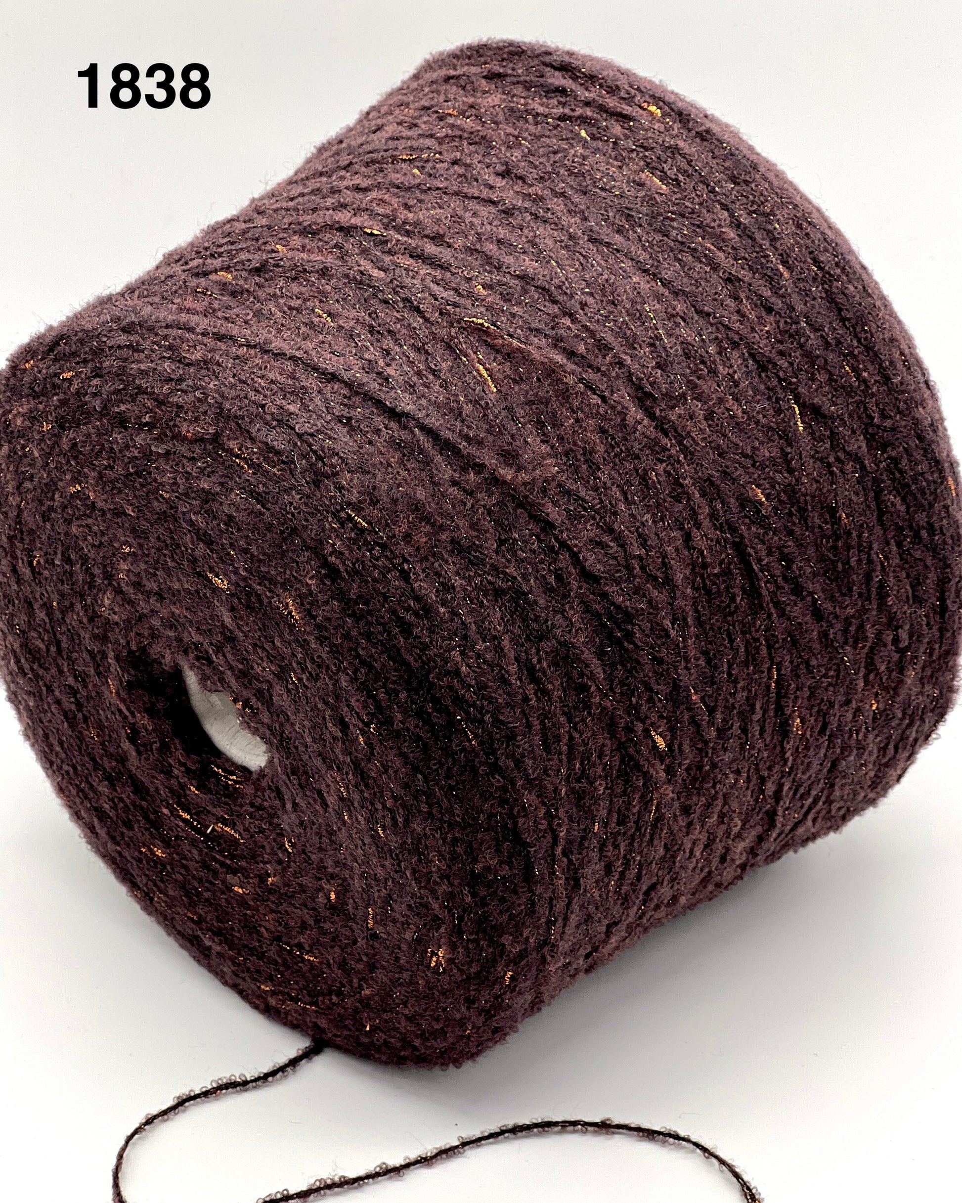 Brown yarn ball on a white background, color number 1838