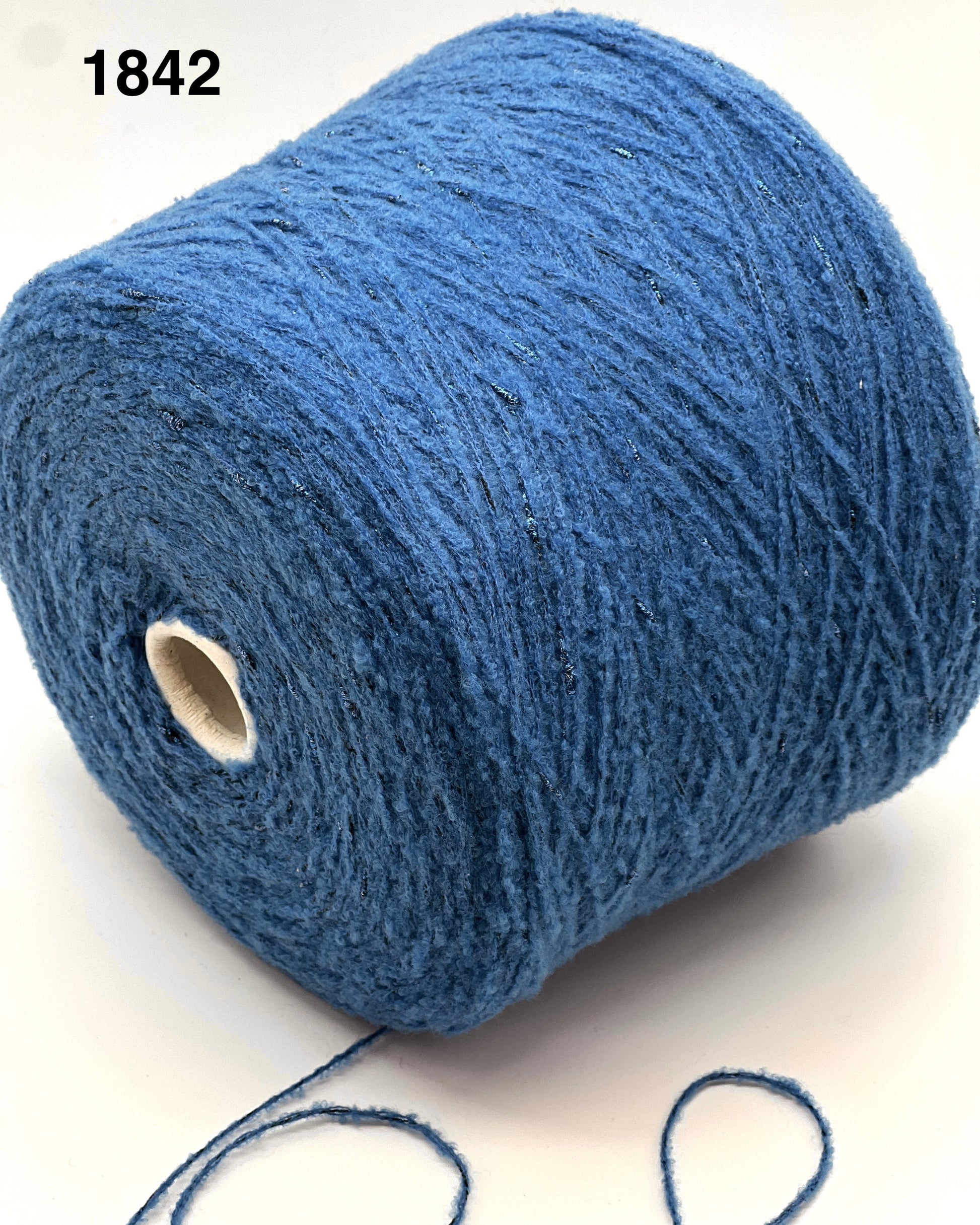 Blue yarn roll on a white background, color 1842