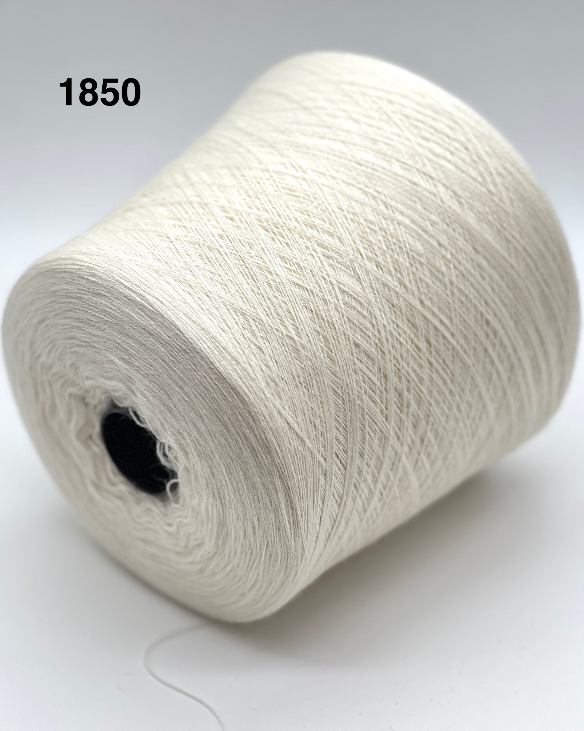 Spool of white yarn labeled '1850' on a light background