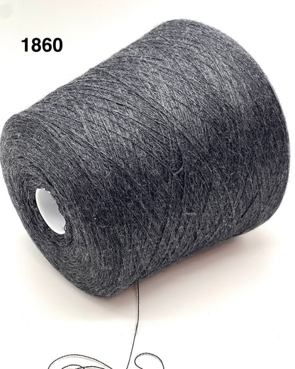 Roll of gray yarn on a white background