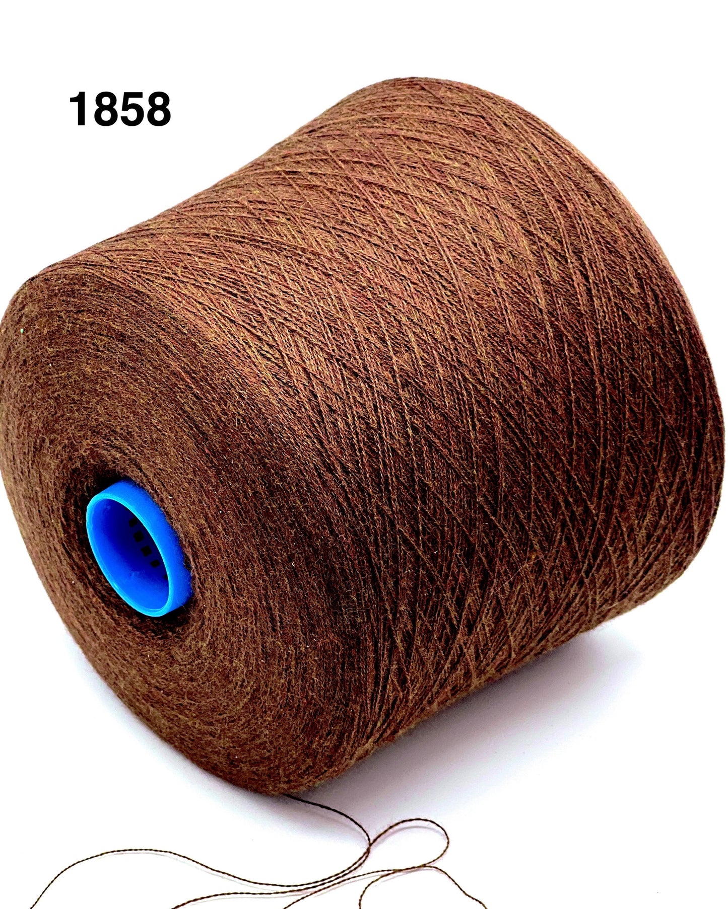 Brown yarn roll with a blue core on a white background