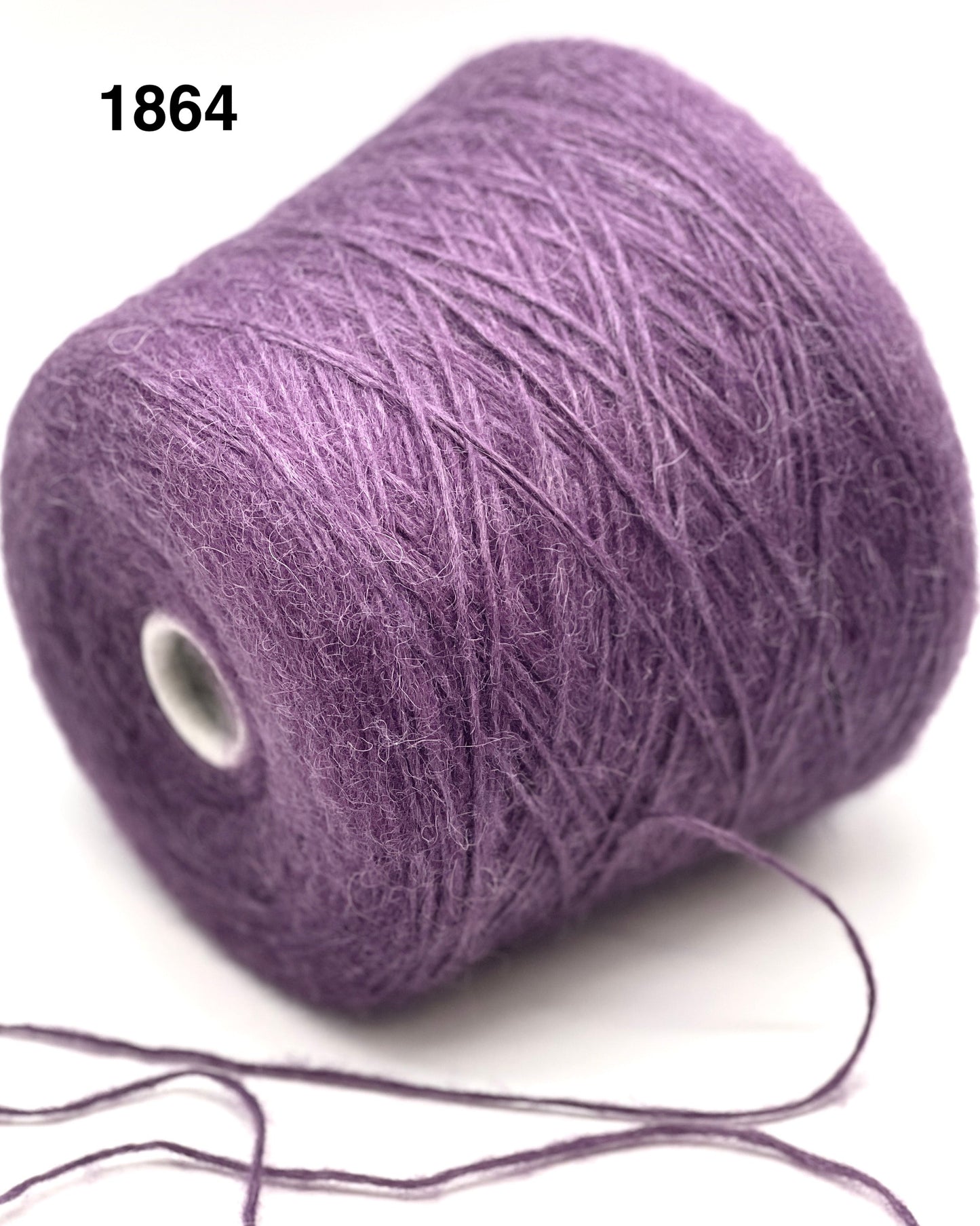 Purple yarn spool on a white background
