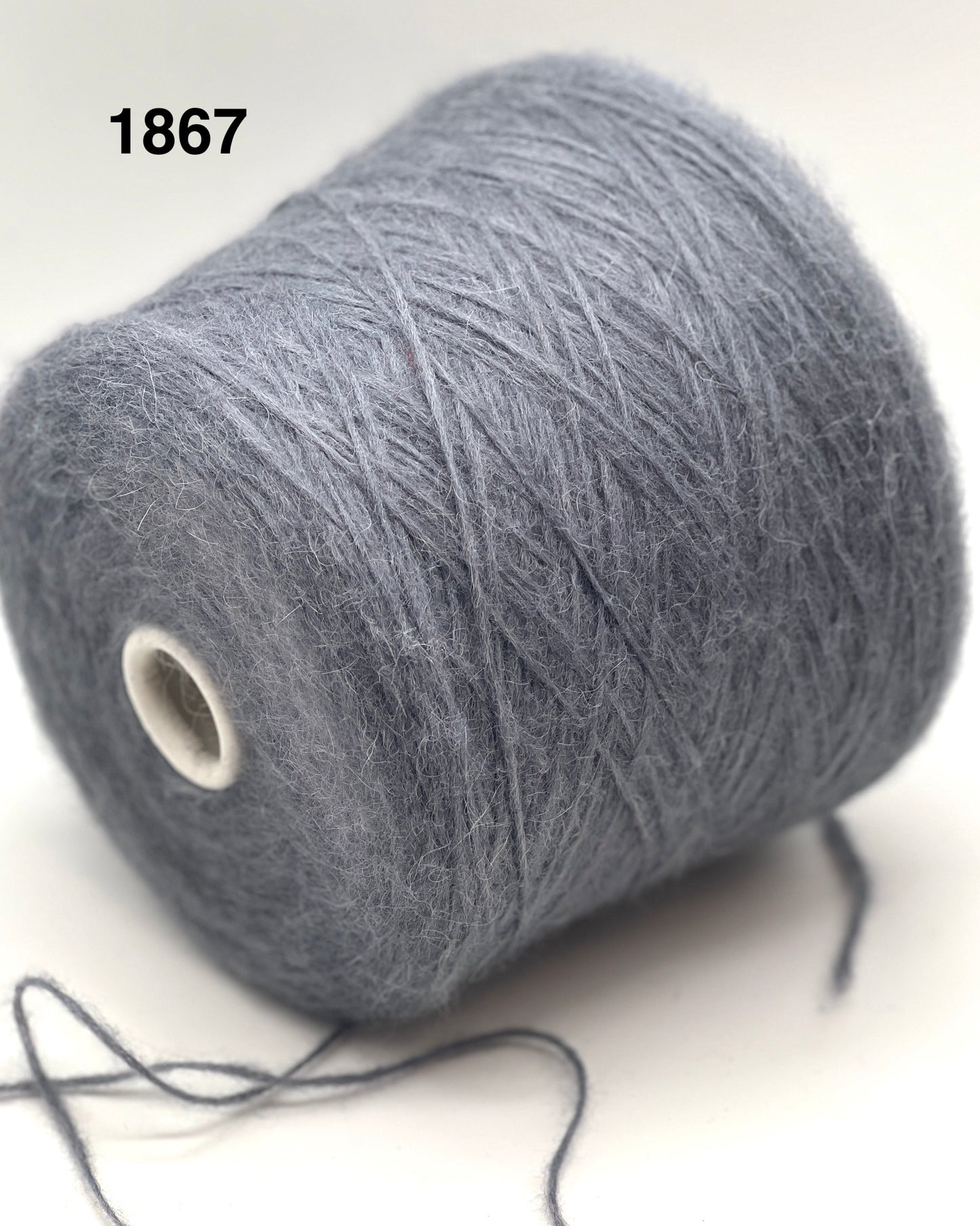 Gray yarn spool on a white background with number 1867.
