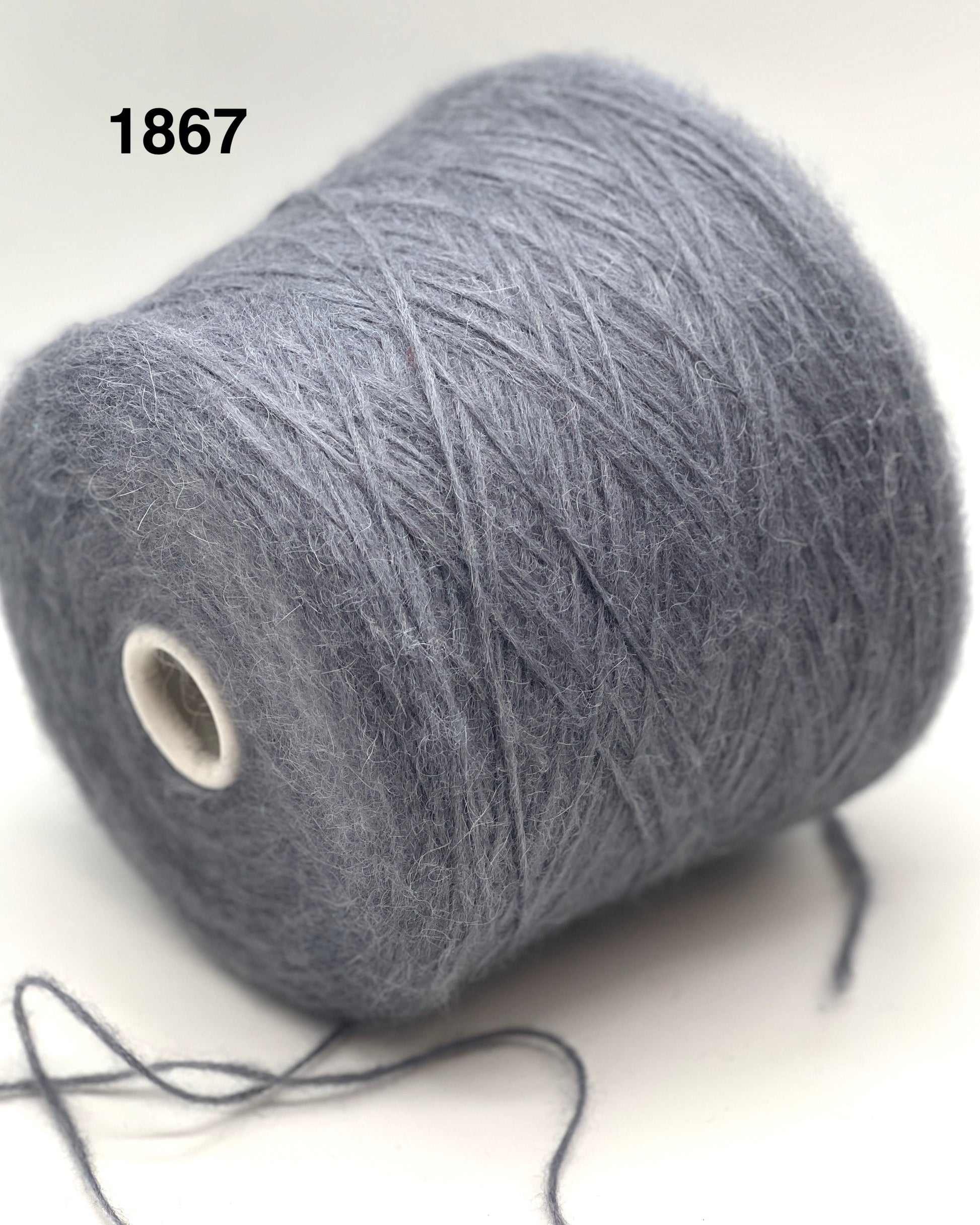 Gray yarn spool on a white background with number 1867.