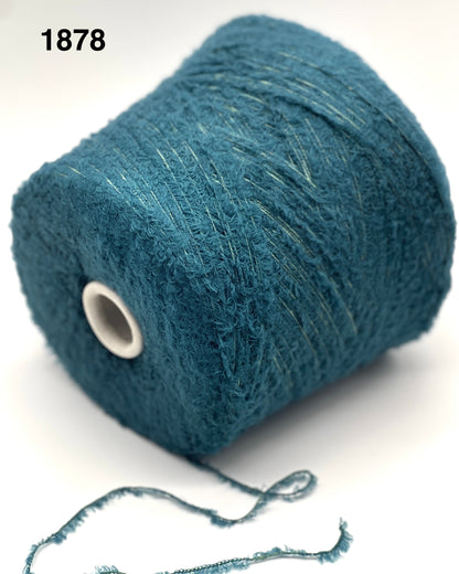 Blue yarn spool on a white background