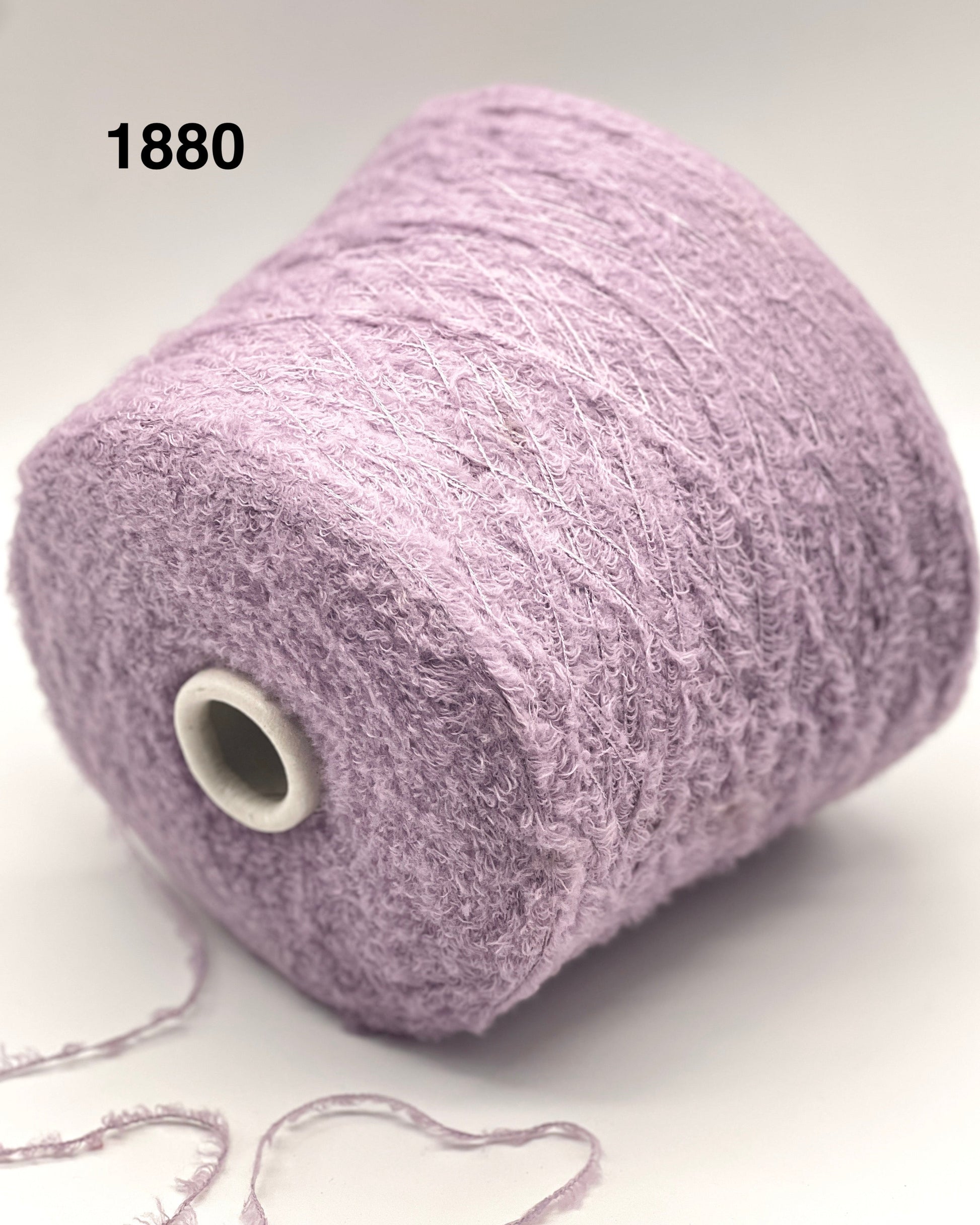 Spool of purple yarn on a white background with number 1880.