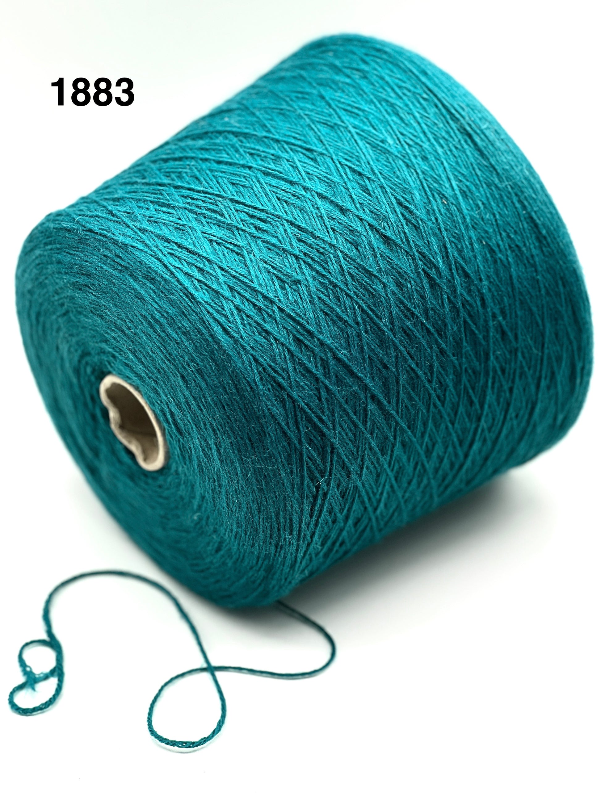 Teal spool of yarn on a white background with '1883' text.