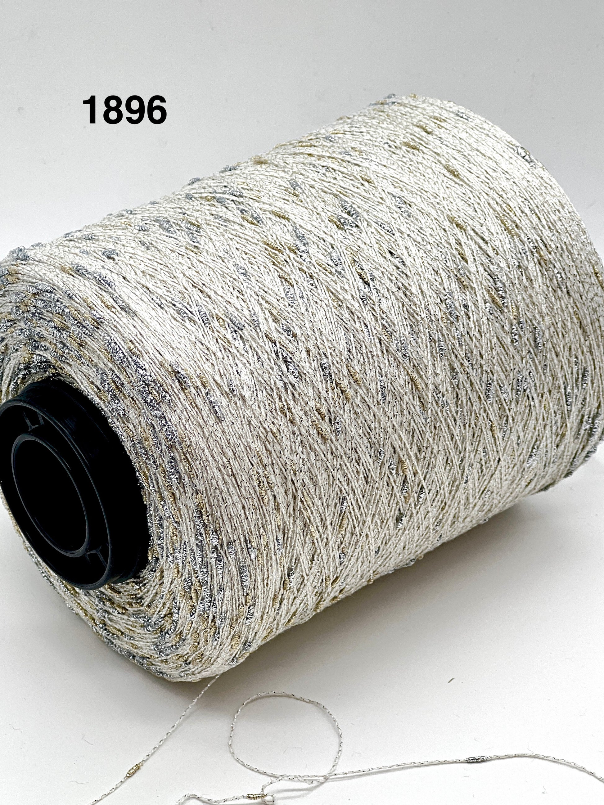 Spool of gray thread on a white background with number 1896.