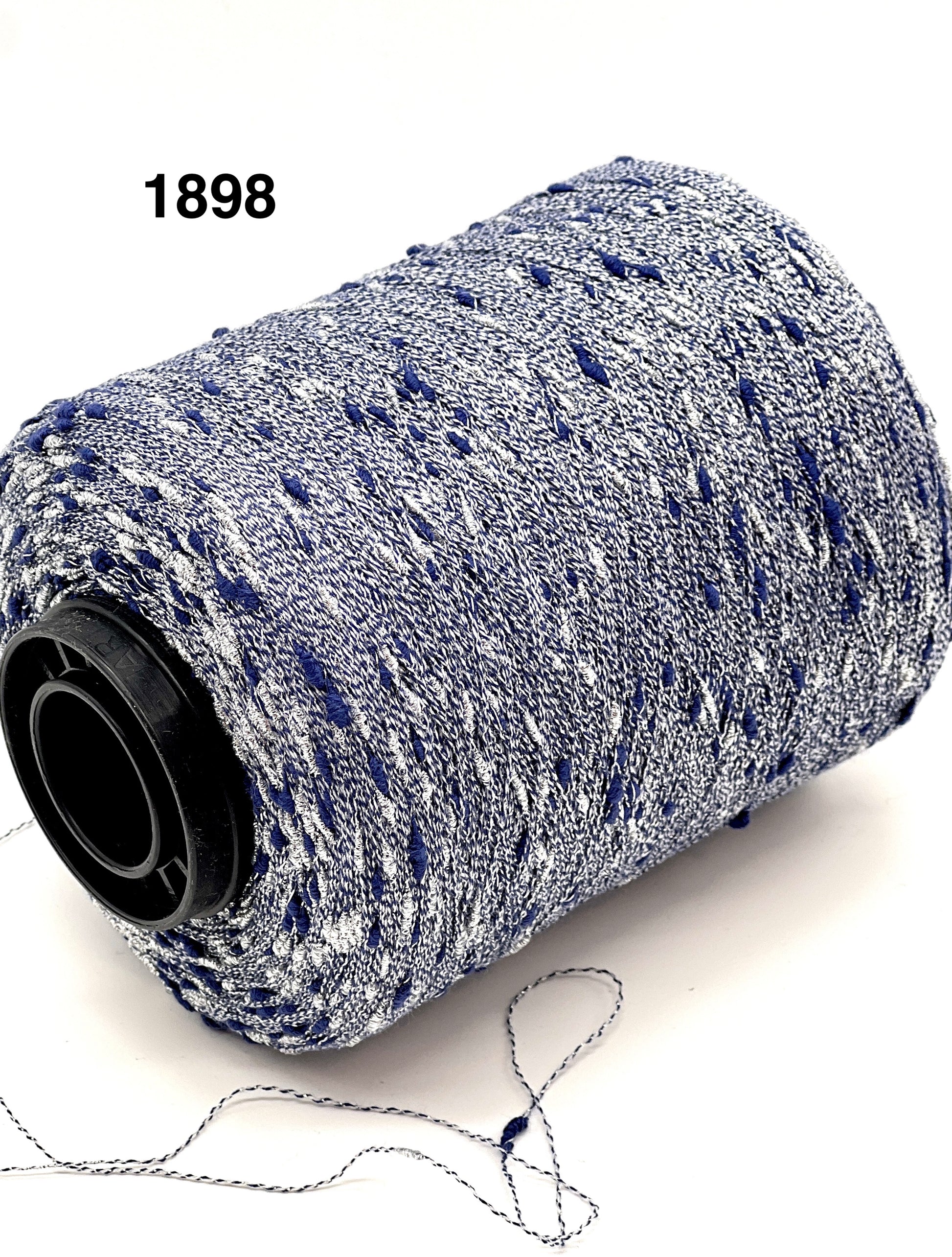 Spool of blue and white yarn on a white background